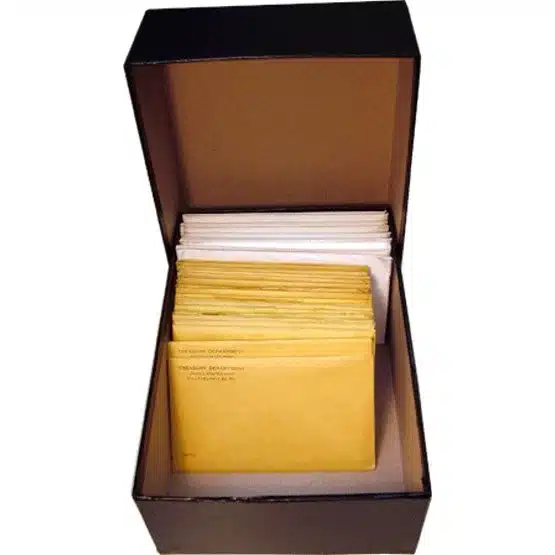 Black container showcasing example contents inside with lid sitting behind image view-20033