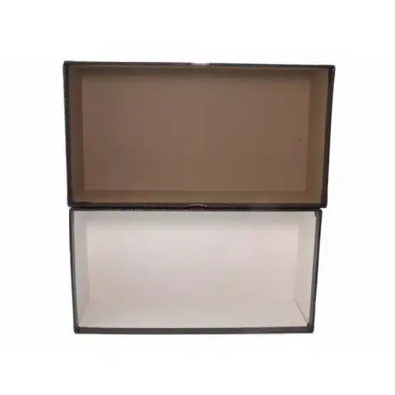 A black and white box with a lid siting directly on top image view-20004