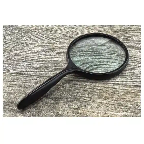 4-inch Large Hand Held Magnifying Glass 2x, lying upright with background image-view-20591DD