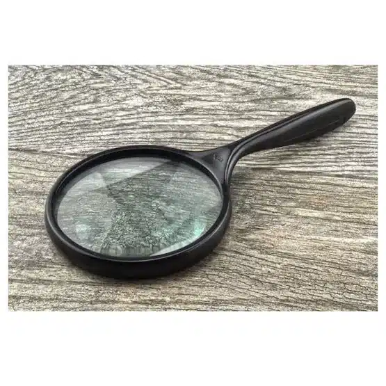 4-inch Large Hand Held Magnifying Glass 2x, lying upside down with background image-view-20591DD