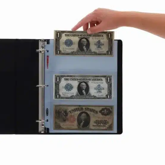 Sample album with hand inserting money, cash not included, image view-20545