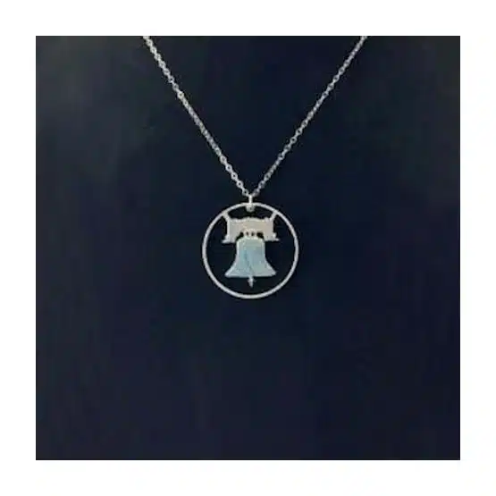 Franklin Half Dollar Necklace Reverse showing the Liberty Bell and Rim, Cut Coin Jewelry on black display, zoomed in image view-20562068
